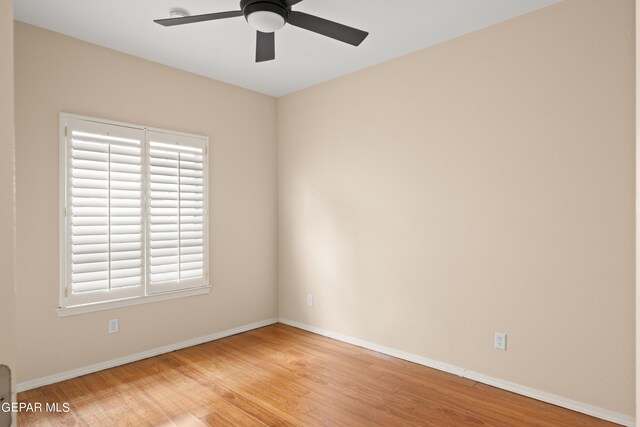 spare room featuring light hardwood / wood-style floors and ceiling fan