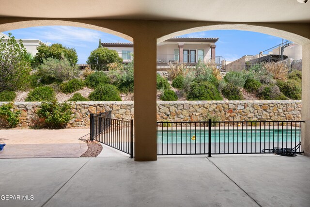 view of patio featuring a fenced in pool