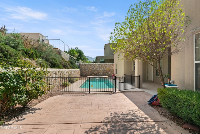 view of patio with a fenced in pool