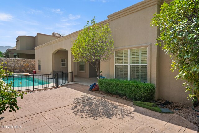 exterior space featuring a fenced in pool