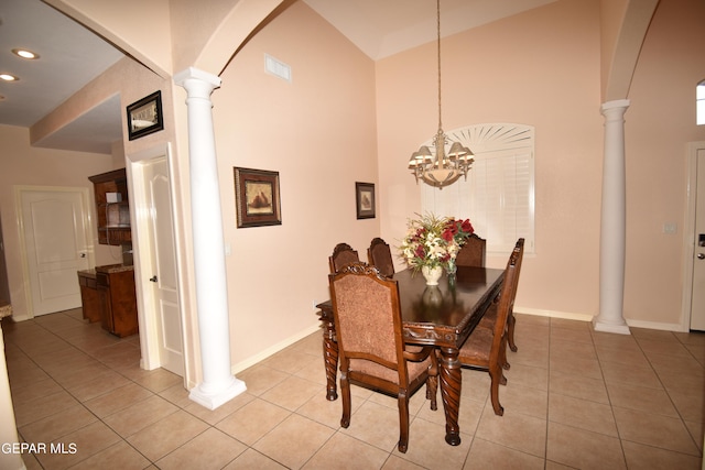 dining space with a high ceiling and tile patterned floors