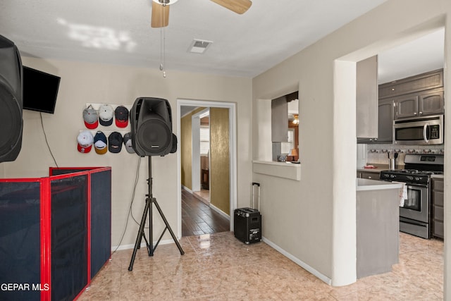 interior space featuring light tile patterned floors and ceiling fan