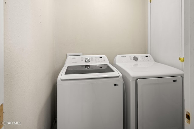 laundry area featuring laundry area and separate washer and dryer