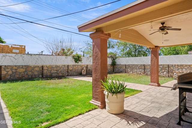 view of patio with a fenced backyard and a ceiling fan