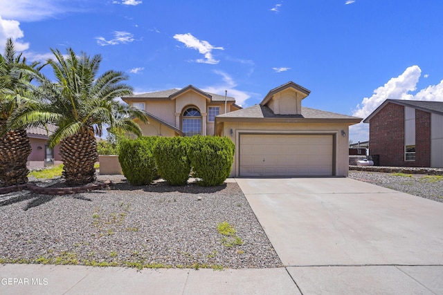 view of front of home featuring stucco siding, an attached garage, and concrete driveway