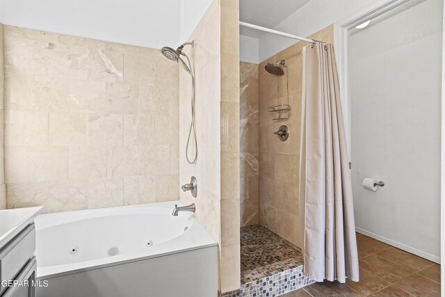 bathroom featuring tile patterned floors, vanity, and separate shower and tub