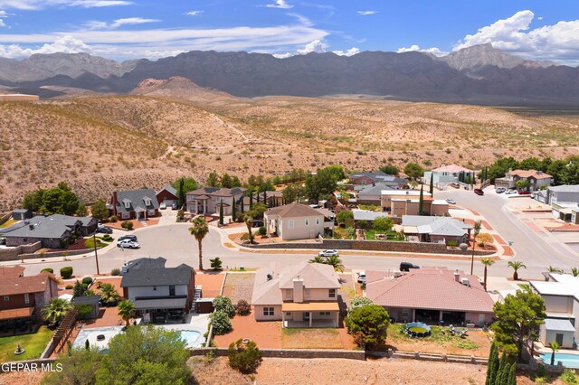 birds eye view of property featuring a mountain view