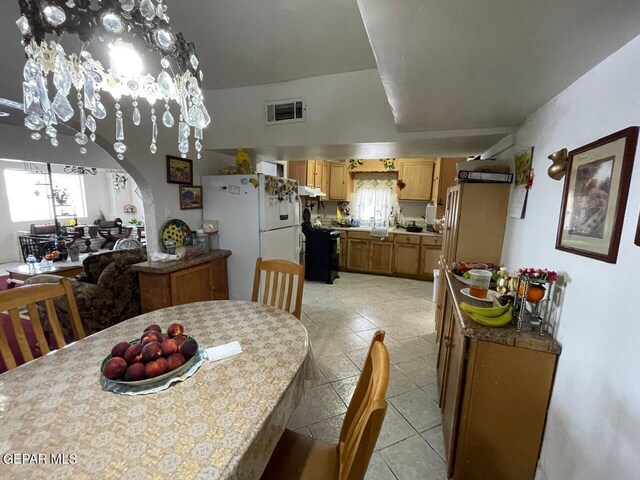 dining area featuring a wealth of natural light and light tile patterned floors