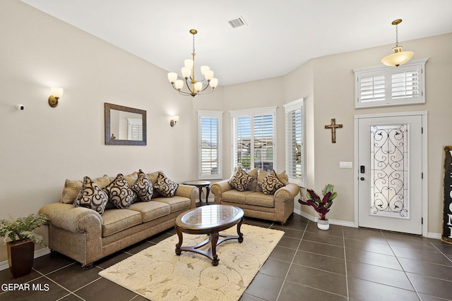 tiled living room featuring a chandelier