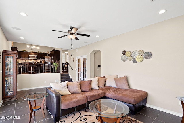 tiled living room featuring ceiling fan