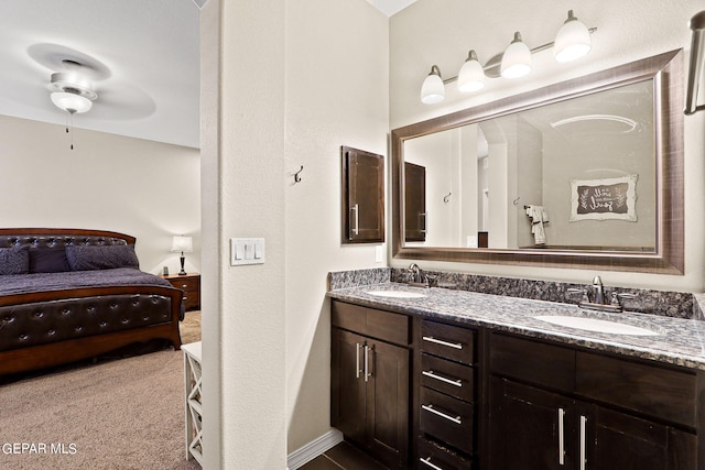 bathroom with ceiling fan and vanity