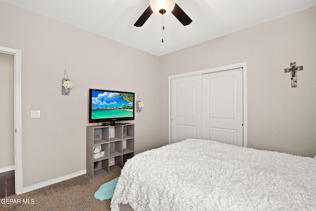 carpeted bedroom featuring a closet and ceiling fan