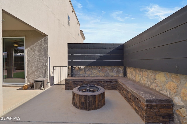 view of patio / terrace featuring a fire pit