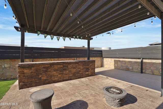 view of patio / terrace featuring a fire pit