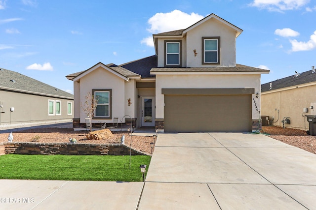 view of front of home featuring stucco siding, an attached garage, roof with shingles, and driveway