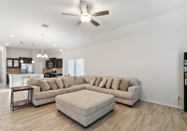 living area featuring visible vents, ceiling fan with notable chandelier, recessed lighting, light wood-style floors, and baseboards