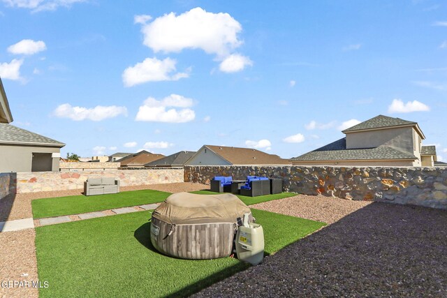 view of yard featuring outdoor lounge area and a fenced backyard