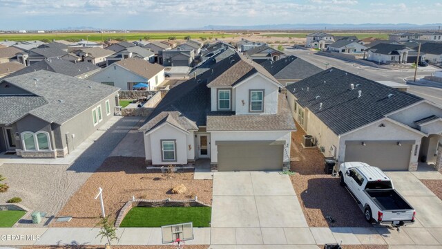 birds eye view of property with a residential view