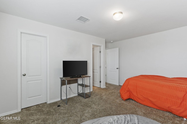 carpeted bedroom with baseboards and visible vents