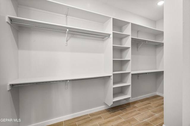 spacious closet featuring wood tiled floor