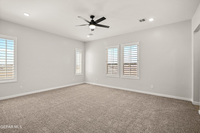 empty room with a ceiling fan, recessed lighting, carpet flooring, and baseboards