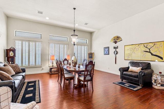 dining area with dark hardwood / wood-style floors