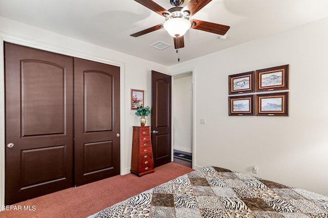 carpeted bedroom with ceiling fan and a closet