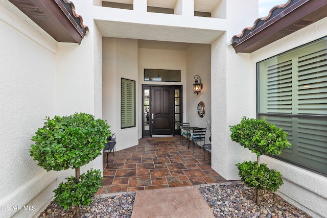 entrance to property featuring a patio area