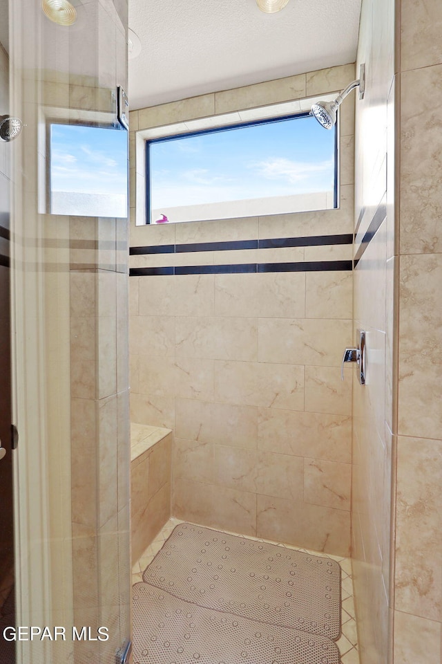 bathroom featuring tiled shower