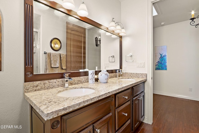 bathroom featuring wood-type flooring and vanity