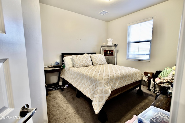 carpeted bedroom with visible vents