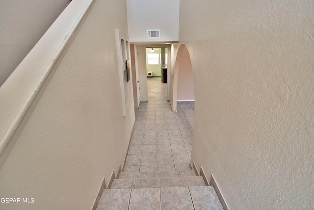 hallway featuring light tile patterned flooring