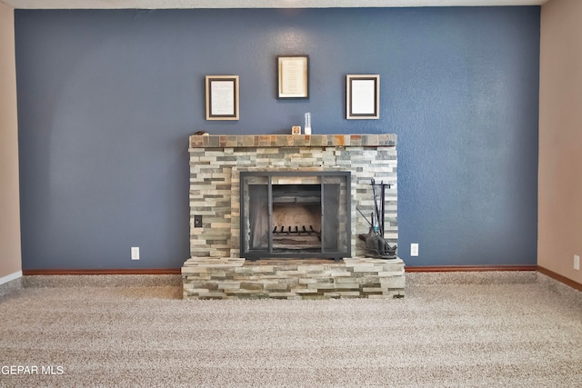 room details featuring carpet flooring and a fireplace