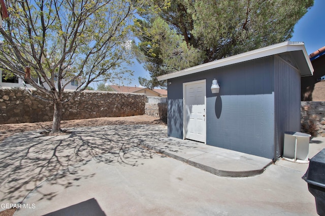 view of patio / terrace with a storage unit