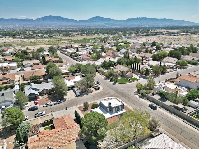 birds eye view of property with a mountain view