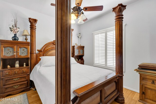 bedroom with ceiling fan and light hardwood / wood-style flooring