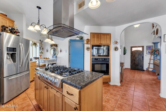 kitchen featuring pendant lighting, a kitchen island, island range hood, appliances with stainless steel finishes, and light tile patterned flooring