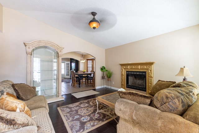 living room featuring vaulted ceiling, hardwood / wood-style floors, and ceiling fan