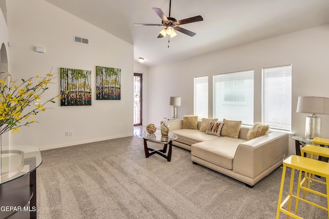 living room with ceiling fan, high vaulted ceiling, light colored carpet, and plenty of natural light