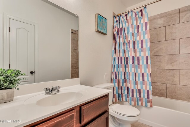 full bathroom featuring toilet, vanity, and shower / bath combination with curtain