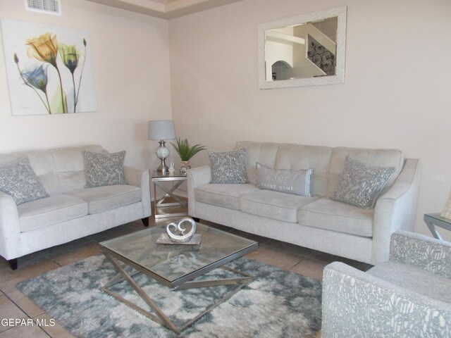 living room featuring dark tile patterned flooring