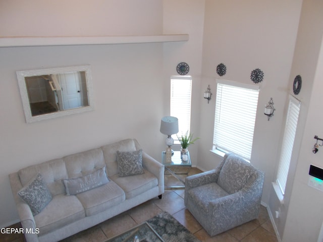 tiled living room featuring vaulted ceiling