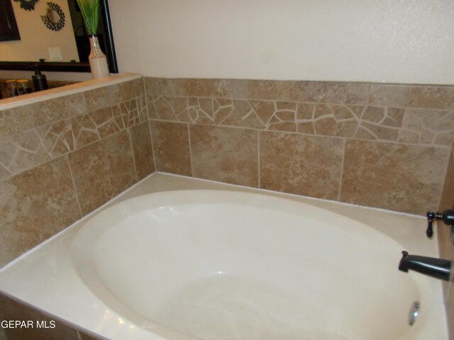 bathroom featuring a tub to relax in