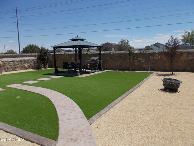 view of yard featuring a patio, an outdoor fire pit, and a gazebo