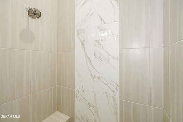 bathroom featuring tiled shower