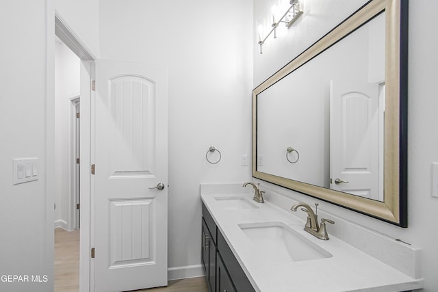 bathroom featuring hardwood / wood-style floors and vanity