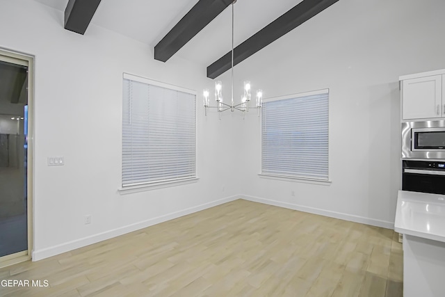 unfurnished dining area with beam ceiling, light hardwood / wood-style floors, high vaulted ceiling, and an inviting chandelier