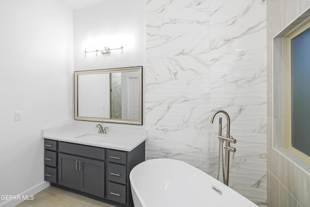 bathroom with a bathing tub and vanity