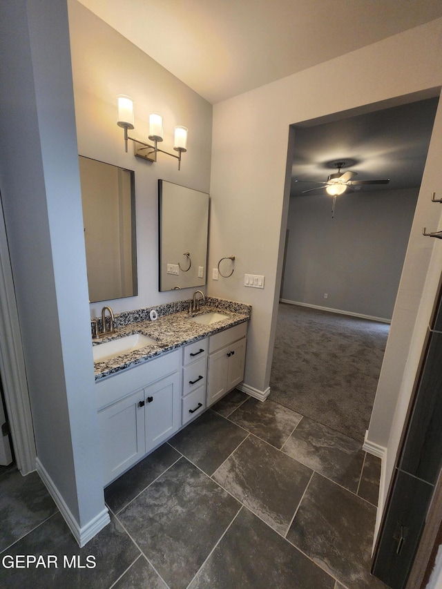 bathroom featuring dual vanity, tile patterned flooring, and ceiling fan