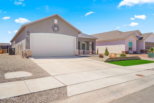 ranch-style home with central air condition unit and a garage